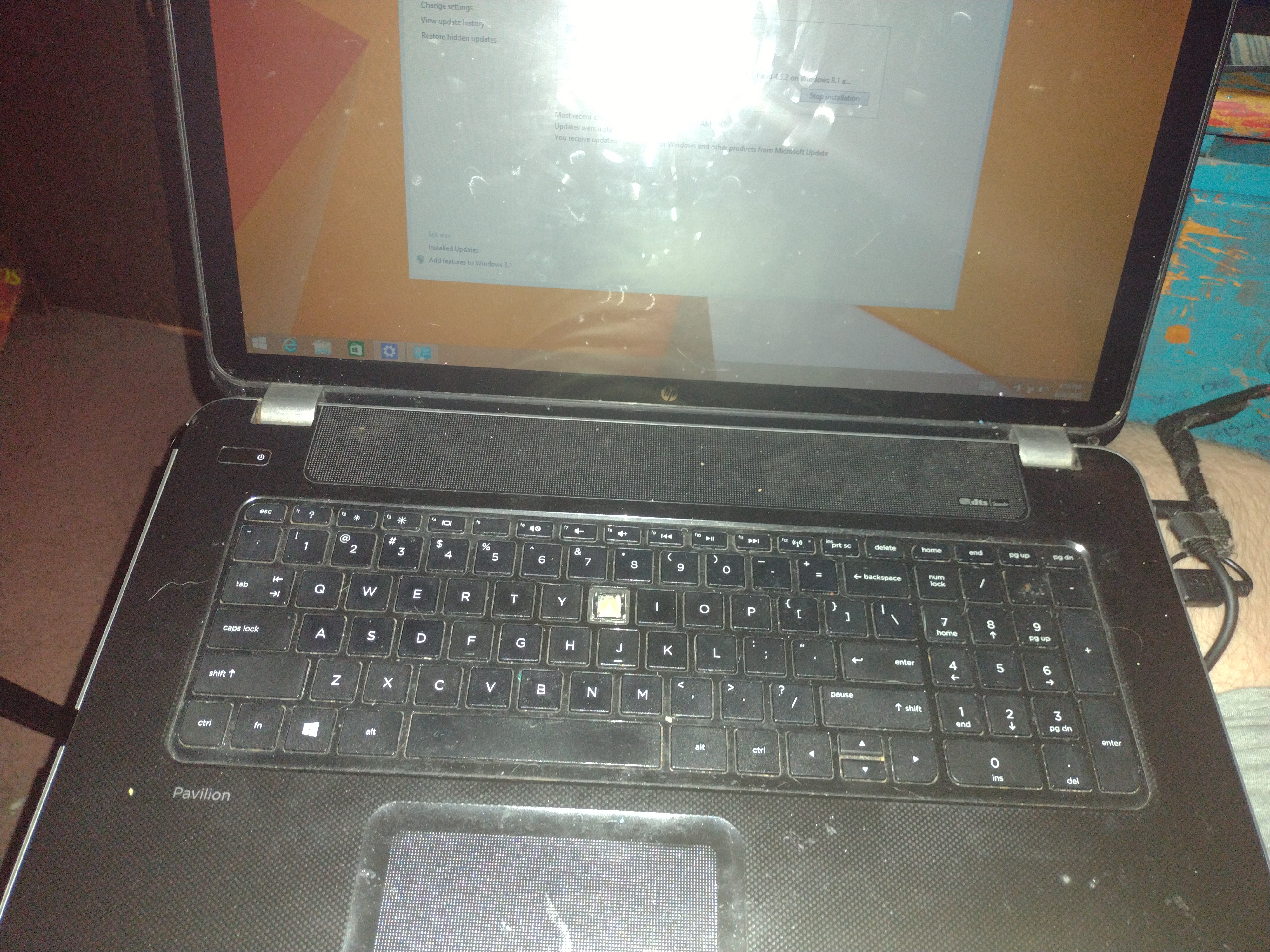 HP Pavilion TS 17 laptop from 2013. Shown in my lap; installing updates on Windows 8.1.
